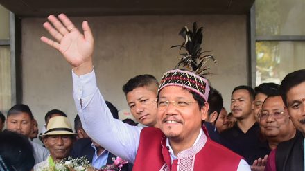 Meghalaya Chief Minister and National People's Party (NPP) chief Conrad Sangma waves at supporters gathered for celebrating his victory in Meghalaya Assembly elections from the South Tura Assembly constituency, Thursday, March 2, 2023. (PTI Photo)