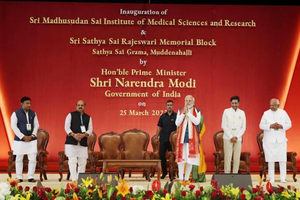  Prime Minister Narendra Modi with Karnataka Chief Minister Basavaraj Bommai, Sadguru Sri Madhusudan Sai and others during the inauguration of Sri Madhusudan Sai Institute of Medical Science & Research, in Chikkaballapur, Saturday, March 25, 2023. (PTI Photo)