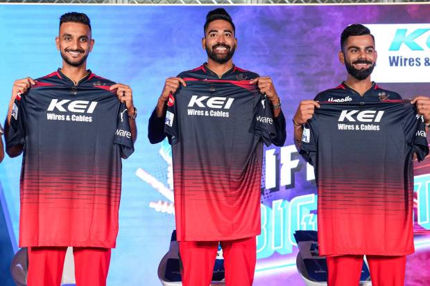Bengaluru: Royal Challengers Bangalore players Virat Kohli, Harshal Patel and Mohd Siraj during an event to launch the team jersey in Bengaluru. (PTI Photo)
