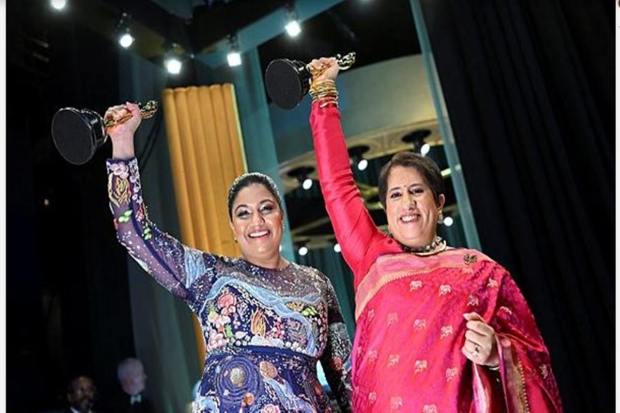 Kartiki Gonsalves and Guneet Monga pose with the Oscar for Best Documentary Short Film for "The Elephant Whisperers" backstage during the Oscars show at the 95th Academy Awards in Hollywood, Los Angeles, (Reuters Image)