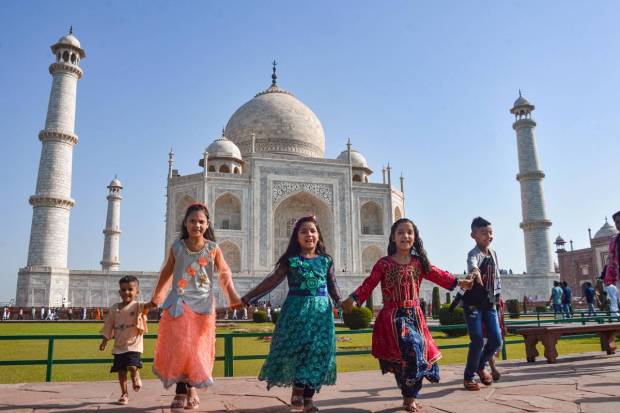 Agra: Children pose for photograph on the occasion of Eid, at Taj Mahal in Agra. (PTI Photo)