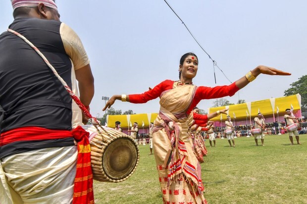 A young woman performs Bihu dance at the annual Mukali Bihu programme, in Guwahati. (Photo: PTI)