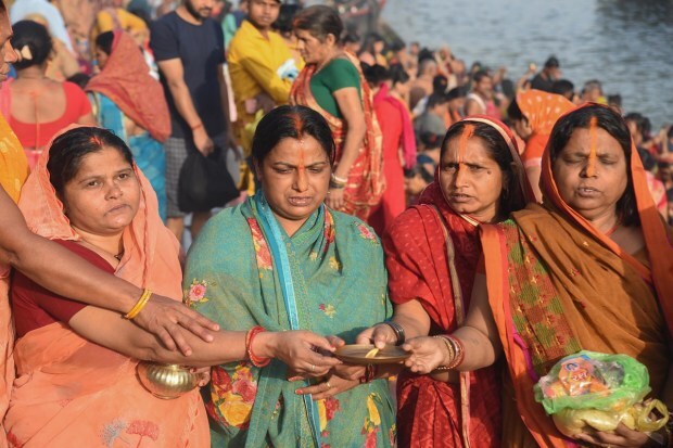  Women perform ritual on the occasion of the Satuani and Baisakhi festival, in Patna. Photo: PTI
