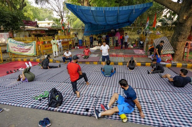 Wrestlers exercise during a training session near Jantar Mantar during their protest in New Delhi on Thursday. (Photo: PTI)