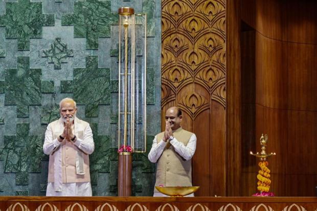 Prime Minister Narendra Modi with Lok Sabha Speaker Om Birla after installing the 'Sengol' in the Lok Sabha chamber at the inauguration of the new Parliament building. (Image/PTI)