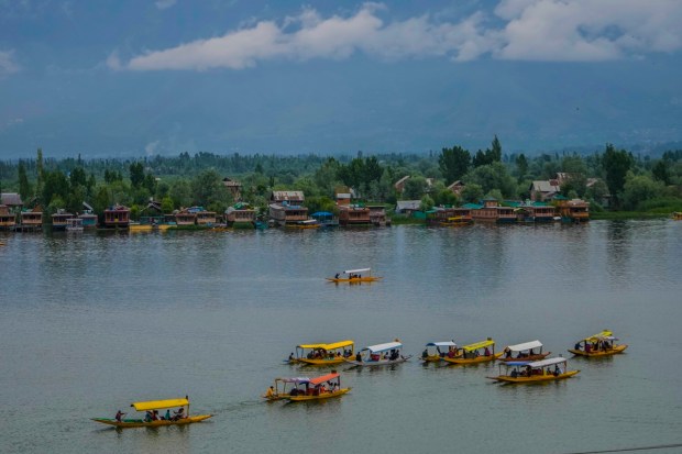 Tourists enjoy boat ride at Dal Lake in Srinagar even as authorities step up security ahead of G20 tourism working group meeting. (AP Photo)