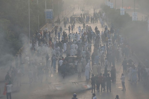Supporters of Pakistan's former Prime Minister Imran Khan block a highway, during a protest against his arrest, in Karachi, Pakistan. (Reuters Photo)