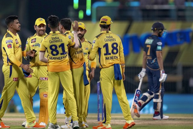 Chennai Super Kings bowler Deepak Chahar celebrates with teammates the wicket of Gujarat Titans batter Wriddhiman Saha. (PTI Photo)
