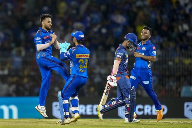 Mumbai Indians bowler Akash Madhwal celebrates with teammates the wicket of Lucknow Super Giants batter Nicholas Pooran during the IPL 2023 Eliminator cricket match between Mumbai Indians and Lucknow Super Giants. (PTI Photo)