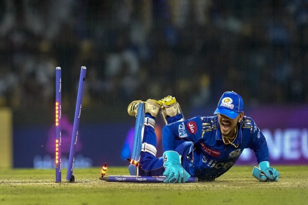 Mumbai Indians wicketkeeper Ishan Kishan runs out Lucknow Super Giants batter Marcus Stoinis during the IPL 2023 Eliminator cricket match. (PTI Photo)