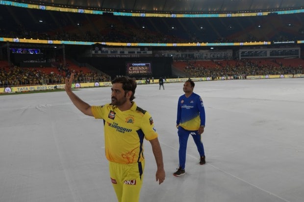 CSK Skipper MS Dhoni waves to the crowd after their win in the Indian Premier League final cricket match against Gujarat Titans in Ahmedabad on May 30, 2023. (Image: AP)