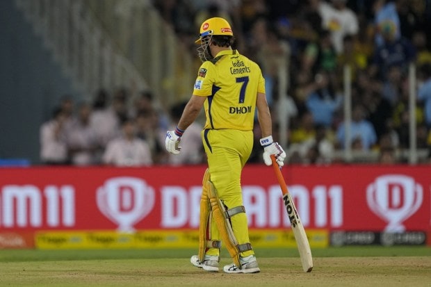 CSK Skipper MS Dhoni walks off the field after losing his wicket during the final IPL cricket match between Chennai Super Kings and Gujarat Titans in Ahmedabad on May 29, 2023. (Image: AP)