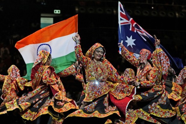 Dancers wave Australian and Indian national flag as they perform ahead of Prime Minister Narendra Modi's arrival to attend a community event at Qudos Bank Arena in Sydney. (Image/AP)
