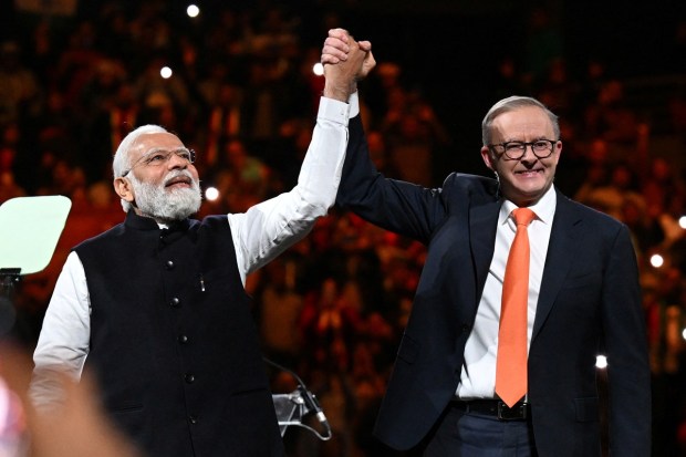 Prime Minister Narendra Modi and Australia's Prime Minister Anthony Albanese attend a community event at Qudos Bank Arena in Sydney. (Image/Reuters)