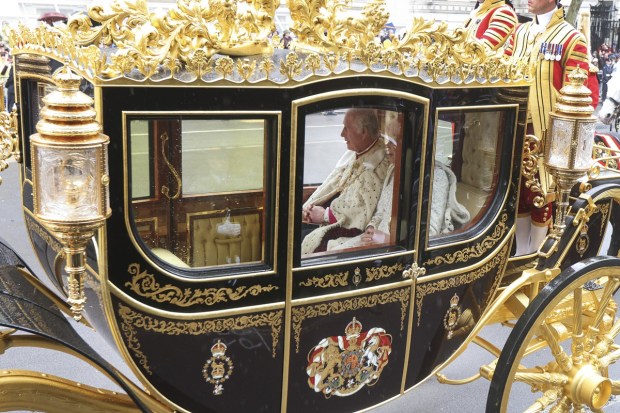 Britain's King Charles III and Camilla, the Queen Consort, are driven past the Cenotaph on Whitehall ahead of the coronation ceremony for Britain's King Charles III in London, Saturday. (Photo: AP)