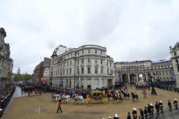 Britain's King Charles III and Britain's Camilla, Queen Consort ride in the Diamond Jubilee State Coach, ahead of the coronation, in London, Saturday. (Photo: AP)
