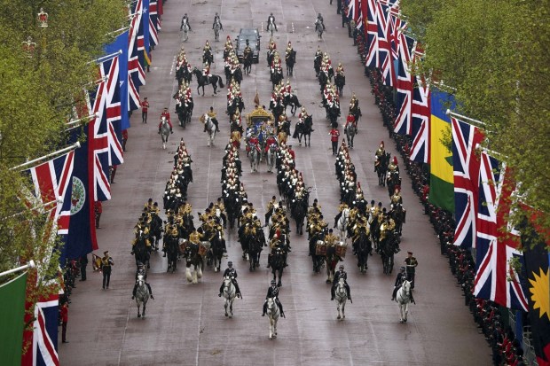 The Diamond Jubilee State Coach, accompanied by the Sovereign's Escort of the Household Cavalry, travels along The Mall in the King's Procession ahead of the coronation ceremony of King Charles III at Westminster Abbey in London, Saturday. (Photo: AP)