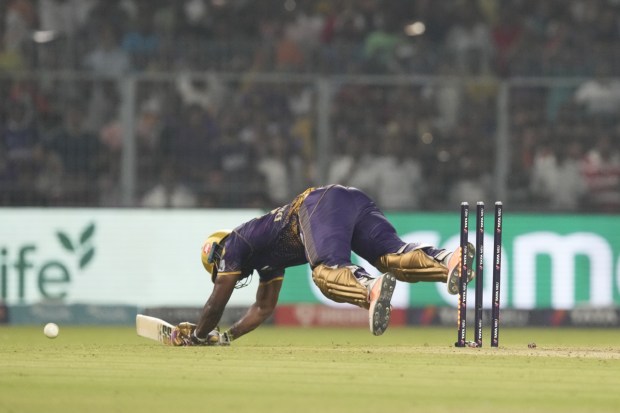 Kolkata Knight Riders' Andre Russell dives unsuccessfully to reach the crease during Indian Premier League cricket match between Kolkata Knight Riders and Punjab Kings in Kolkata. Andre Russell said team mate Rinku Singh's uninhibited batting has eased the pressure on him after the duo combined to seal their five-wicket victory against Punjab Kings.(Photo: AP)