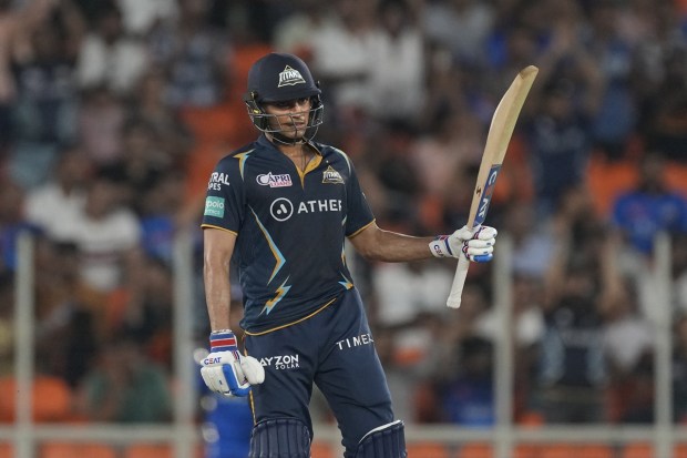 Gujrat Titans' Shubman Gill celebrates his fifty runs during the Indian Premier League qualifier cricket match between Gujarat Titans and Mumbai Indians in Ahmedabad on Friday. (Photo: AP)