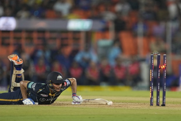 Gujrat Titans' Shubman Gill dives back to the crease successfully during the Indian Premier League qualifier cricket match between Gujarat Titans and Mumbai Indians in Ahmedabad on Friday. (Photo: AP)
