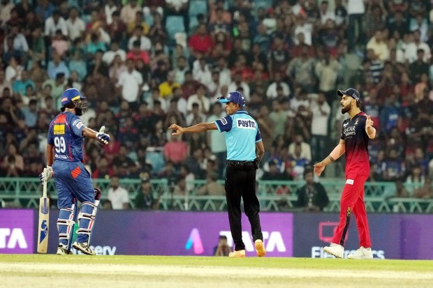 Lucknow Super Giants batter Amit Mishra and Royal Challengers Bangalore player Virat Kohli during the IPL 2023 cricket match between Lucknow Super Giants and Royal Challengers Bangalore in Lucknow on Monday. (Photo: PTI)