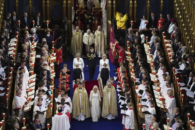 Britain's King Charles III and Camilla, the Queen Consort arrive for the coronation at Westminster Abbey, in London, Saturday. (Photo: AP)