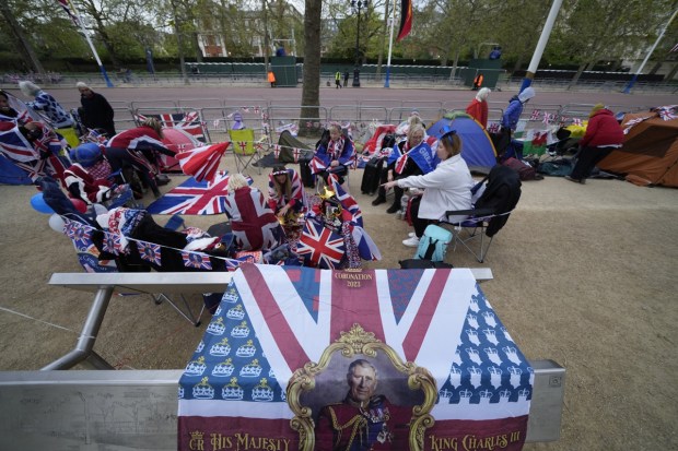 Royal fans who have spent the night camping out along the Mall, part of the Coronation route, wake up in London on Friday. (Photo: AP)