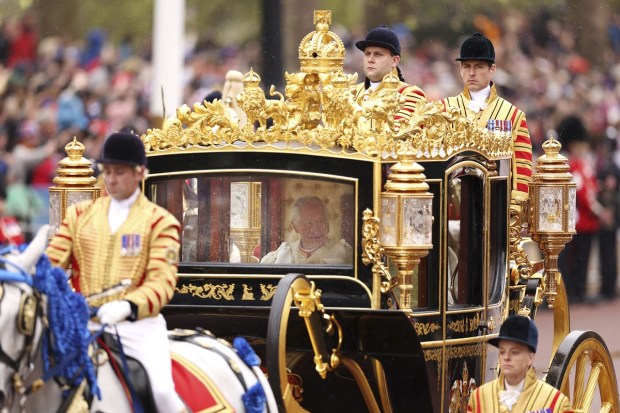Britain's King Charles III and Camilla, the Queen Consort, travel in the Diamond Jubilee Coach flanked by over a thousand Armed Forces route liners and The Sovereign's Escort of the Household Cavalry sets off along the Mall from Buckingham Palace on route to Westminster Abbey for the Coronation of King Charles III, in London, Saturday. (Photo: AP)