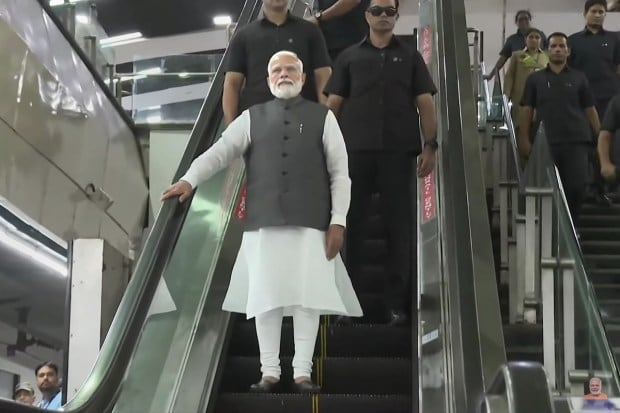 Prime Minister Narendra Modi arrives to travel in Delhi Metro for reaching the Delhi University to attend its centenary celebrations, in New Delhi, Friday, June 30, 2023. (PTI Photo)