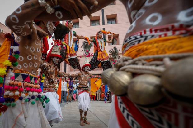 Hindu devotees perform a tribal dance outside the Jagannath temple in Ahmedabad. REUTERS