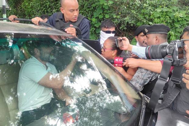 Supporters of Rahul Gandhi, a senior leader of India's main opposition Congress party, speak with him after his convoy, heading to Churachandpur, was stopped by the police in Bishnupur district, Manipur, India. REUTERS