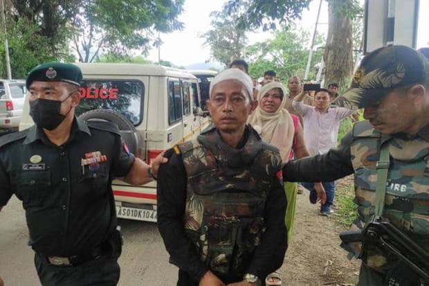 An injured police officer is escorted towards a safe area after Congress party senior leader Rahul Gandhi's convoy, heading to Churachandpur, was stopped by police and his supporters came out to protest, in Bishnupur northeastern state of Manipur, India. REUTERS