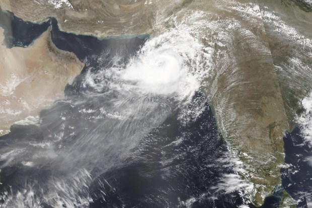 This Thursday, June 15, 2023, satellite image released by NASA shows Cyclone Biparjoy approaching southern Pakistan. Biparjoy made landfall on Thursday evening as a vast swath of western India and neighboring southern Pakistan braced for flash floods, heavy rain and high winds. (NASA Photo)