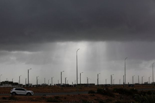 A view of rain clouds before the arrival of cyclonic storm Biparjoy. IMD says that Biparjoy is expected to make landfall near Jakhau port as a “very severe cyclonic storm” with maximum wind speed reaching up to 150 kilometres per hour. The weather department says that the intensity of rainfall will increase as the powerful weather system approaches the coast. Isolated places in Kutch, Devbhumi Dwarka and Jamnagar districts likely to witness extremely heavy rainfall.(Photo Credits: Reuters)