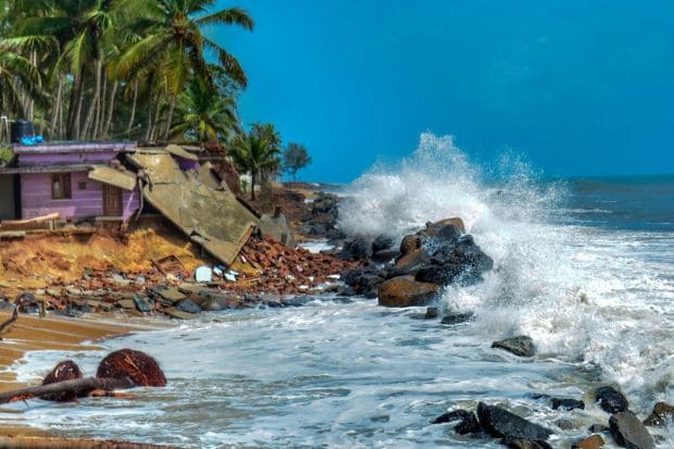 High tides crash at the damaged houses due to sea erosion, at Bettampady, ahead of the cyclonic storm. IMD says that a storm surge of about 2-3 metres above the astronomical tide is likely to inundate low-lying areas of the districts that are likely to be affected due to the landfall. The tides could rise up to 3-6 metres in some places. (Photo Credits: PTI)