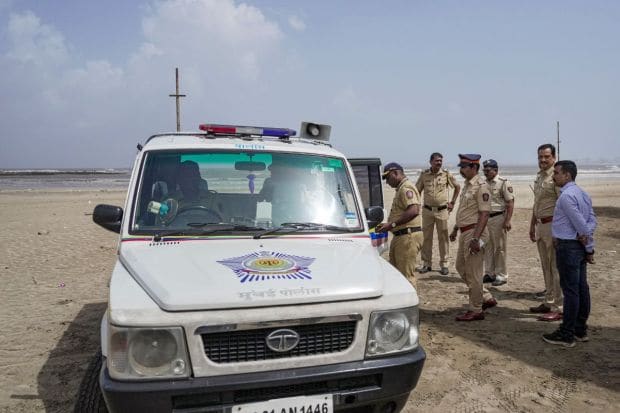 Police personnel on patrol while high tidal waves lash the shore as the Biporjoy cyclone intensifies into a severe cyclonic storm. Meanwhile, PM Modi and Amit Shah have attended separate review meetings in order to ensure cyclone preparedness. (PTI Photo)