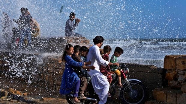 The extremely severe cyclonic storm ‘Cyclone Biparjoy’ weakened on Tuesday into a very severe cyclonic storm, the India Meteorological Department (IMD) informed. Currently, the cyclone is centered approximately 290 km southwest of Gujarat's Porbandar and is moving northwards at a speed of five kilometers per hour. According to the weather department, Biparjoy is expected to make landfall in Gujarat's coastal region as well as adjoining Pakistan coasts on Thursday. NDRF teams have been deployed in Mumbai and Gujarat as the states prepare for impact. Here we bring to you a glimpse of these sea-side areas where people are evacuating as part of safety measures. (PTI Photo)