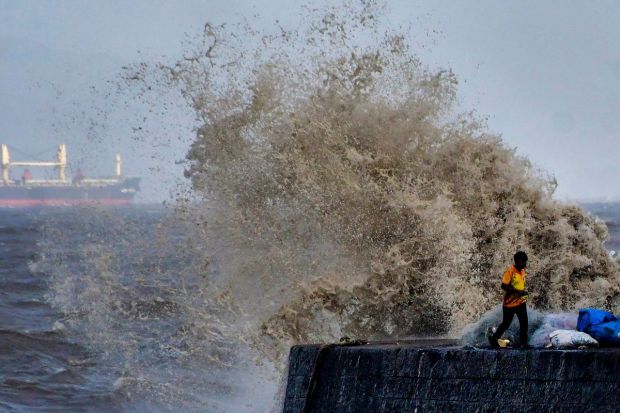 High tides crash at the sea front at Colaba, ahead of cyclone Biparjoy’s landfall in Kutch, in Mumbai. (PTI Photo)