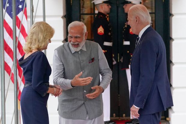 Modi was received by the president and the first lady, and before entering the building, they posed for photos and were seen chatting. The camaraderie between leaders was visible as they seen laughing and engaged in conversation.(Photo Credits: AP)