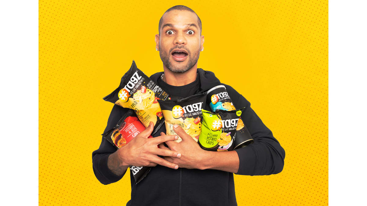 With the help of Shikhar Dhawan, TagZ Foods hopes to reach out to more consumers With the help of Shikhar Dhawan, TagZ Foods hopes to reach out to more consumers