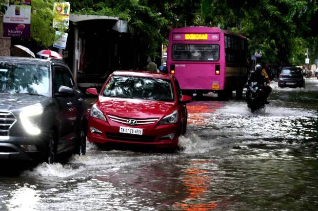 Chennai: Vehicles wade through the waterlogged Rajiv Gandhi IT Expressway after rainfall, in Chennai. (PTI Photo)
