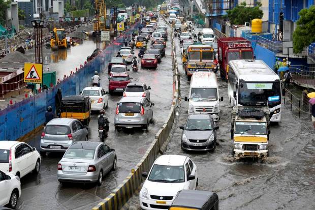 Chennai: Vehicles wade through the waterlogged Rajiv Gandhi IT Expressway after rainfall, in Chennai. (PTI Photo)