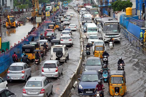 Chennai: Vehicles wade through the waterlogged Rajiv Gandhi IT Expressway after rainfall, in Chennai. (PTI Photo)