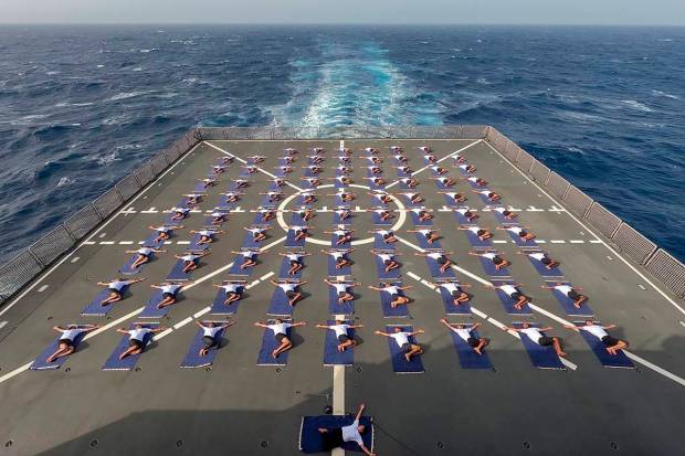 Mumbai: Navy personnel perform yoga on-board INS Deepak. In the run-up to International Day of Yoga, several naval ships are conducting yoga and meditation session on-board. (PTI Photo)