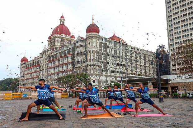 Mumbai: Navy personnel perform yoga at the Gateway of India in Mumbai. In the run-up to International Day of Yoga, several naval ships are conducting yoga and meditation session on-board. (PTI Photo)