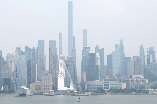 The midtown Manhattan skyline is shrouded in haze and smoke which drifted south from wildfires in Canada, in New York City, New York. (Image: REUTERS/Mike Segar)