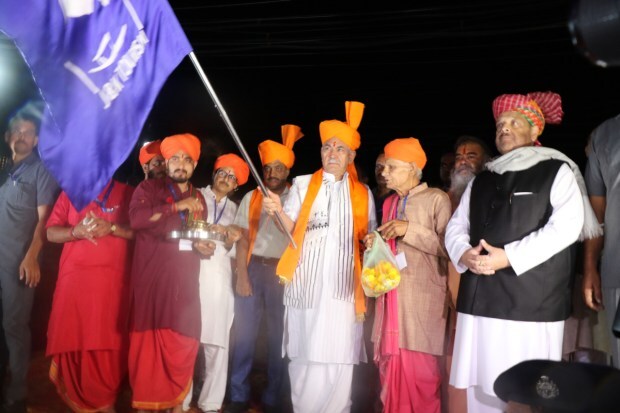 Jammu and Kashmir Lt Governor Manoj Sinha flags off the first batch of pilgrims for the Amarnath Yatra 2023 after conducting a puja at the Bhagwati Nagar base camp in Jammu on June 30. (Image: PTI)