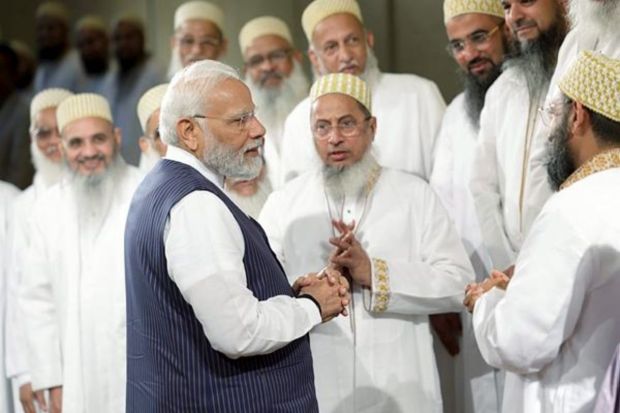 Prime Minister Narendra Modi interacts with members of the Indian Community, in Cairo, Saturday. (PTI Photo)