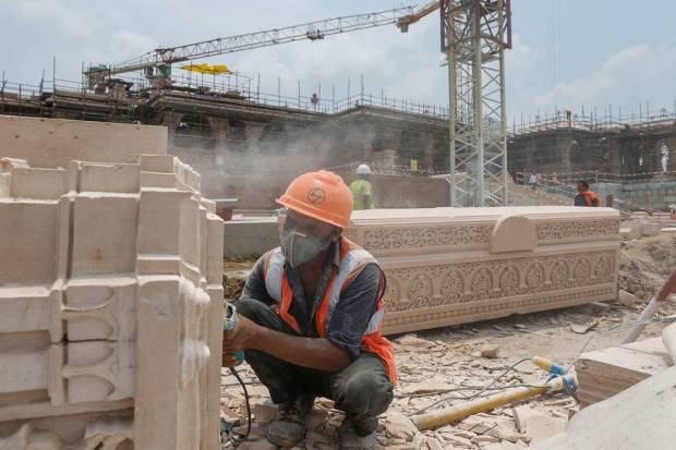 In Ayodhya, a worker carves a stone at the construction site of Hindu Ram Temple. REUTERS