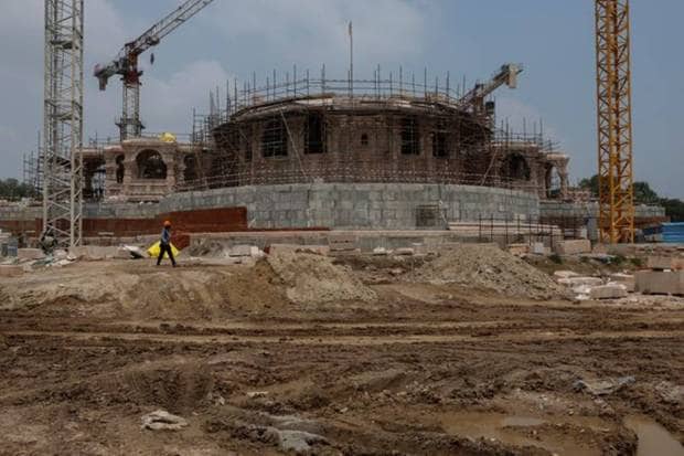 A worker walks in front of the under construction Hindu Ram Temple in Ayodhya. REUTERS